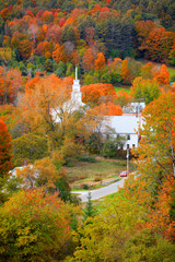 Small church in Topsham village in Vermont in the middle of fall foliage