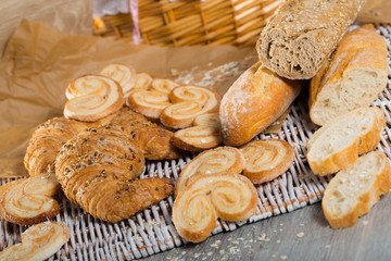 Fototapeta na wymiar Various kinds of bread and bakery products on table