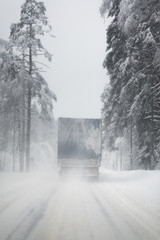 Truck drives through cold weather conditions - 222831585