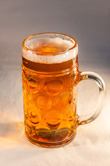 Traditional Octoberfest Bavarian beer in a big one liter mug with wet walls, Germany