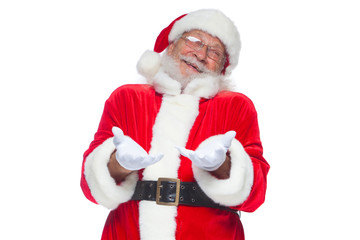 Christmas. Good Santa Claus in white gloves shows faces, grimaces, shows his tongue. Not standard behavior. Isolated on white background.