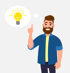 Fototapeta na wymiar Joyful young man pointing up index finger. In the thought bubble bulb is brightening. Idea, innovation, imagination, creativity concept illustration in vector cartoon style.