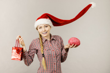 Christmas woman holding shopping bag and brain