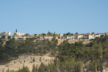 Fototapeta na wymiar Jerusalem houses on the hill shot from below the road level