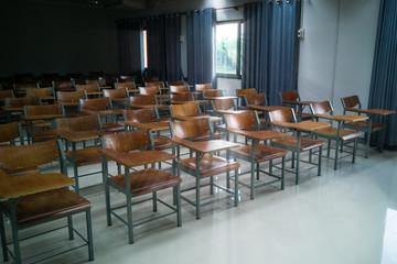 University classroom with many wooden chairs