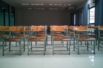 University classroom with many wooden chairs