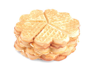 Delicious sweet Belgian waffles in the form of hearts stacked in a stack on a white isolated background