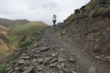 Woman in Kazbeghi Mountains (Georgia country)
