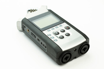 Dictation machine on white background. Digital voice recorder. Portable device for sound recording.