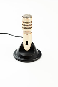 Stereo recorder microphone, vertical image. Mini stereo microphone isolated on white background. Modern sound recording equipment.