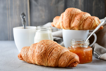 coffee with milk and croissants, jam