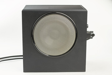Large black stereo box with round speaker. Powerful bass speaker. Modern sound equipment.
