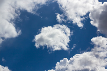 White fluffy clouds in the blue sky