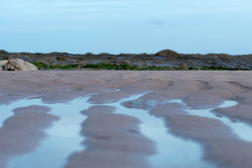 Rocks and cliffs near Eastbourne in United Kingdom while there is a sunset at the background.