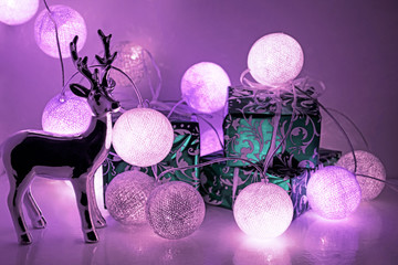 Round electric Christmas lights with some decor elements.