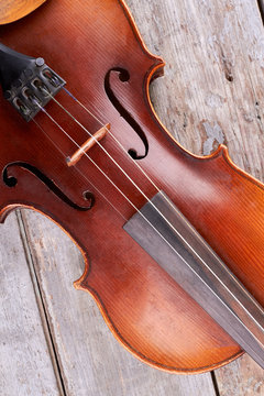 Close up brown violin instrument. Detail of old classical cello. Classical music equipment.