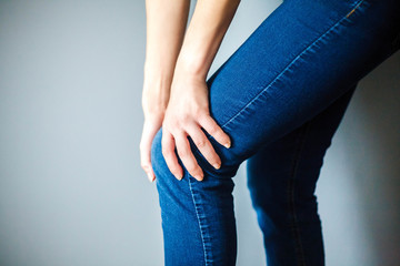 Woman suffering from pain in knee,