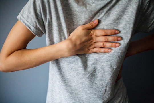 Woman Is Clutching Her Chest