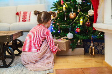 Little girl with Christmas presents