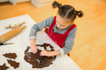 Girl baking chocolate cookies