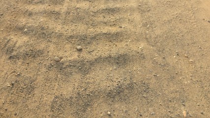 road from gravel as background, soil as texture, wavy country road