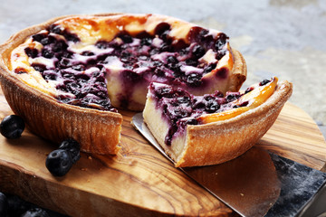 Blueberry pie or homemade cheesecake with blueberries. Delicous dessert blueberry tart