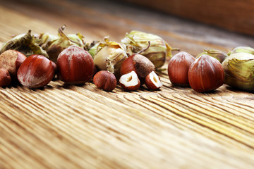 hazelnut with shell and craked and hazelnut leaves.