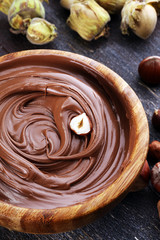 Homemade hazelnut spread in wooden bowl. Hazelnut Nougat cream
