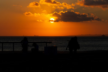 Silhouetted People at Sunset