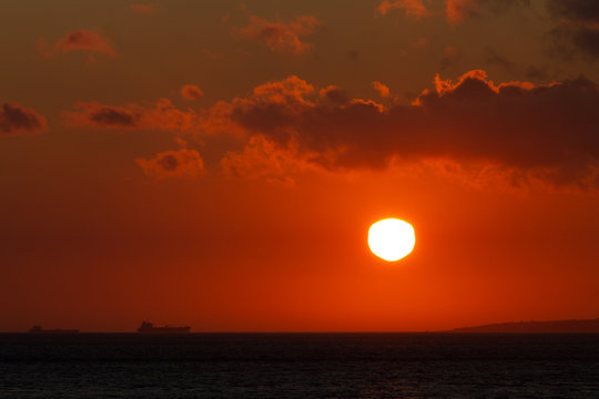 Distant Ferry at Sunset
