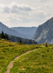 A path and a marker in the Mountains