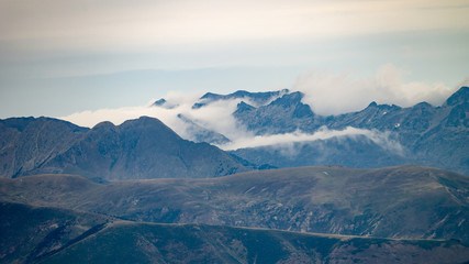Fototapeta na wymiar Cloud Formation Surround Mountain Tops