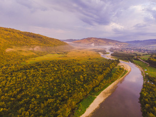 landscape view, mountains on sunset with fig and river