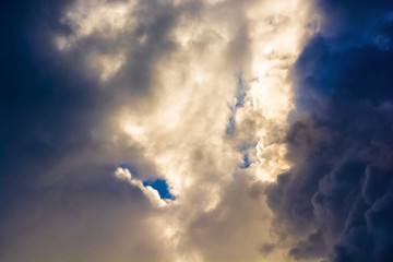 Dark storm clouds in the sky. Blurring background. Bright colors.