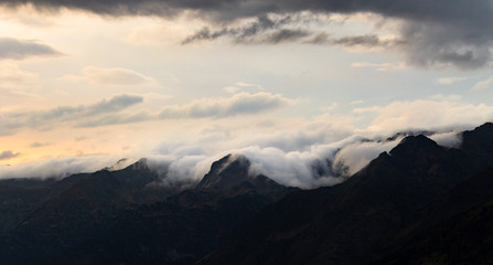 Panoramic View of Clouds Surrounding the Mountains