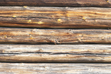Old wooden wall log cabin village house. Logs of pine, laying horizontally.