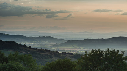 Beautiful dramatic Summer sunset landscape over English countryside with stunning light