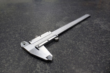 caliper on marble slab, metrological equipment, measuring tool