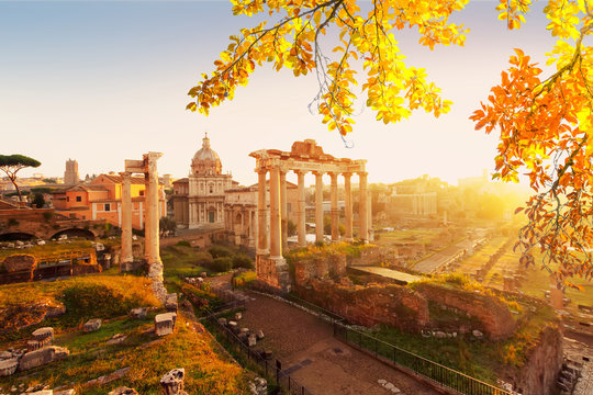 Forum - Roman ruins with cityscape of Rome with warm sunrire light, Italy af fall