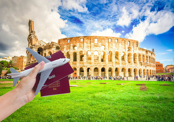 Plane travel concept, hand holding passports with plane isolated on white background
