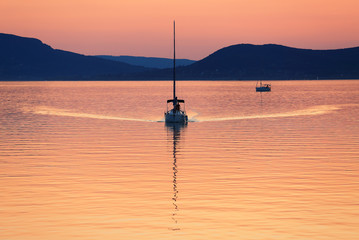 Sailing boats on Lake Balaton at sunset