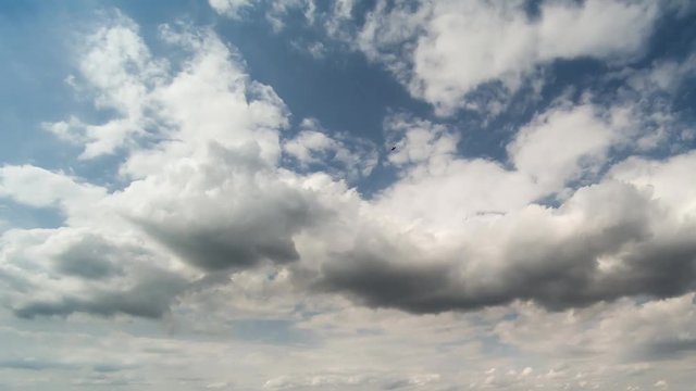 Timelapse white clouds on blue sky