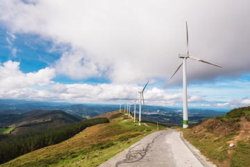 Fototapeta na wymiar Renewable energy. Wind turbines, eolic park in scenic landscape of basque country, Spain.