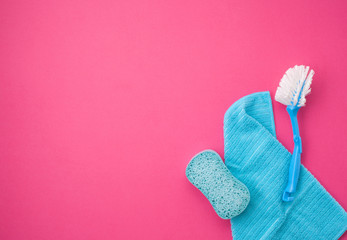 Detergents and cleaning accessories in pastel color. Cleaning service, small business idea. Top view.