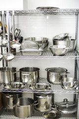 Clean kitchen ware on kitchen shelves