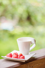 Tasty fresh strawberry on a white plate