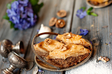 Pieces of tasty sweet pie on a metal dish