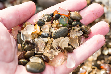 Sea beach glass in a person's hand