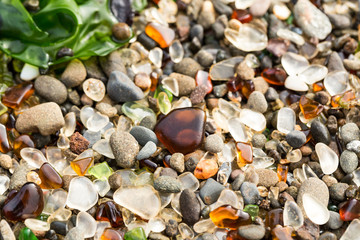 Piles of sea glass on a pacific beach
