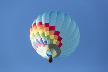 Hot air balloons flying in a beautiful blue clear sky